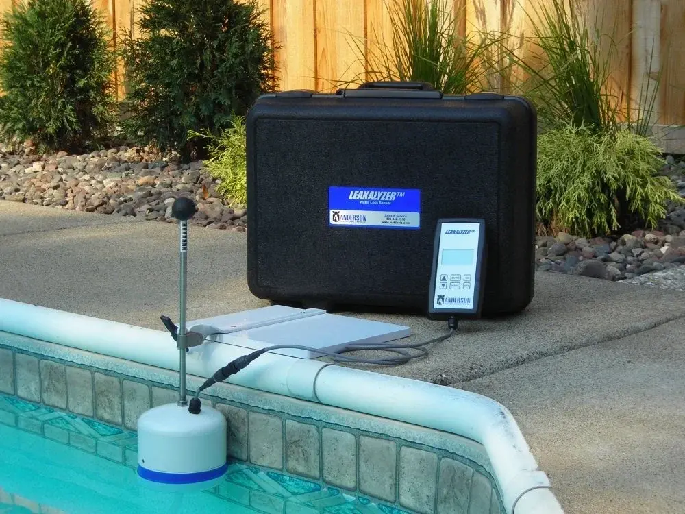 Leak detection equipment including a Leakalyzer device and control unit positioned at a residential pool's edge - Carlito's Way Pool Leak Detection, Miami, FL