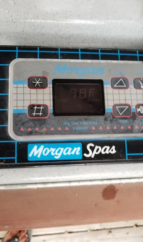 Close-up of a dusty Morgan Spas control panel with digital display and buttons - Pro-Tech Pool Services, San Antonio, TX